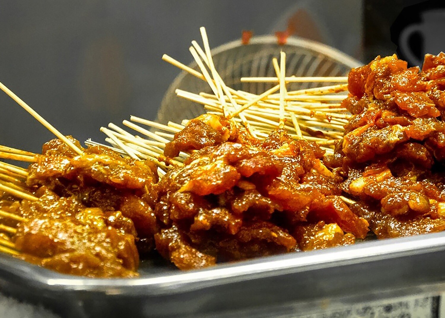 Chicken Satay on a bed of rice &amp; Corn Cob.