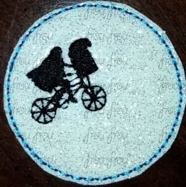 Clippie Extra Terrestrial on bike with moon Machine Embroidery In The Hoop Project 1.5, 2, 3, and 4 inch