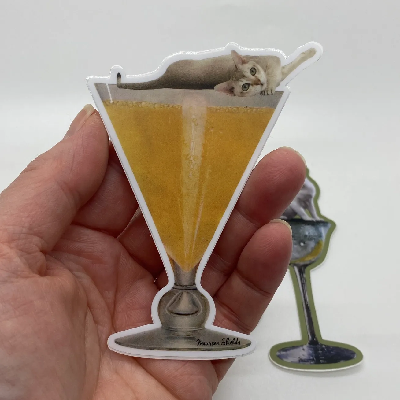 Cat On A Glass Of Orange Juice Sticker
