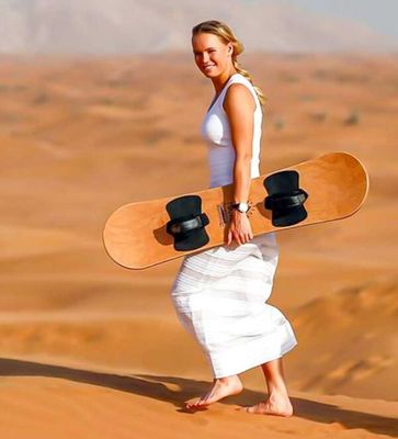 Abu Dhabi sandboarding and camel ride, morning desert tour