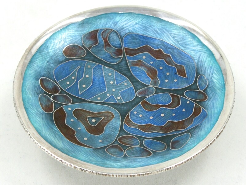 Tiny Silver Cloisonne enamel Pebble Pool Dish on a concrete base.
