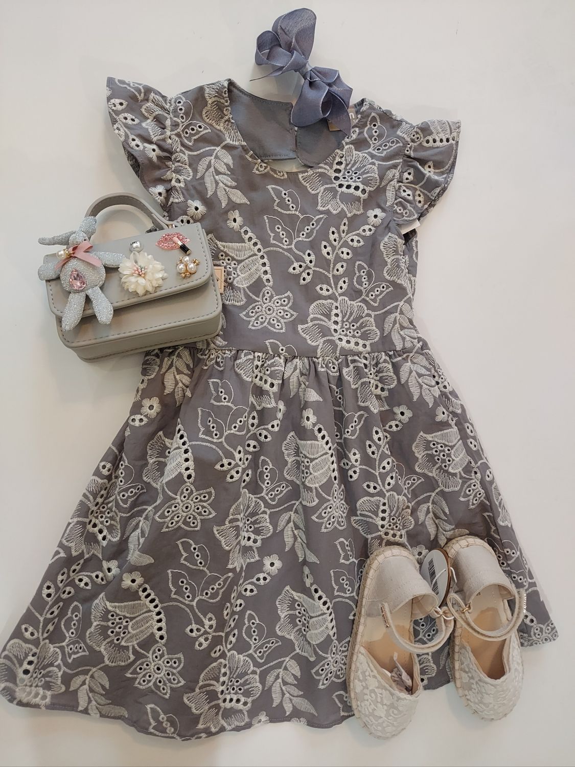 Brazilian Milon cotton embroidered fabric in pewter grey. Open back shoulders
