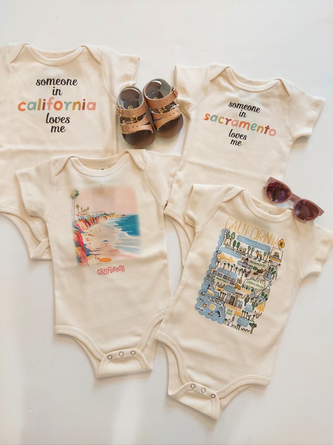 Morado Designs &quot;Someone loves me in california&quot; organic cotton bodysuit onesie