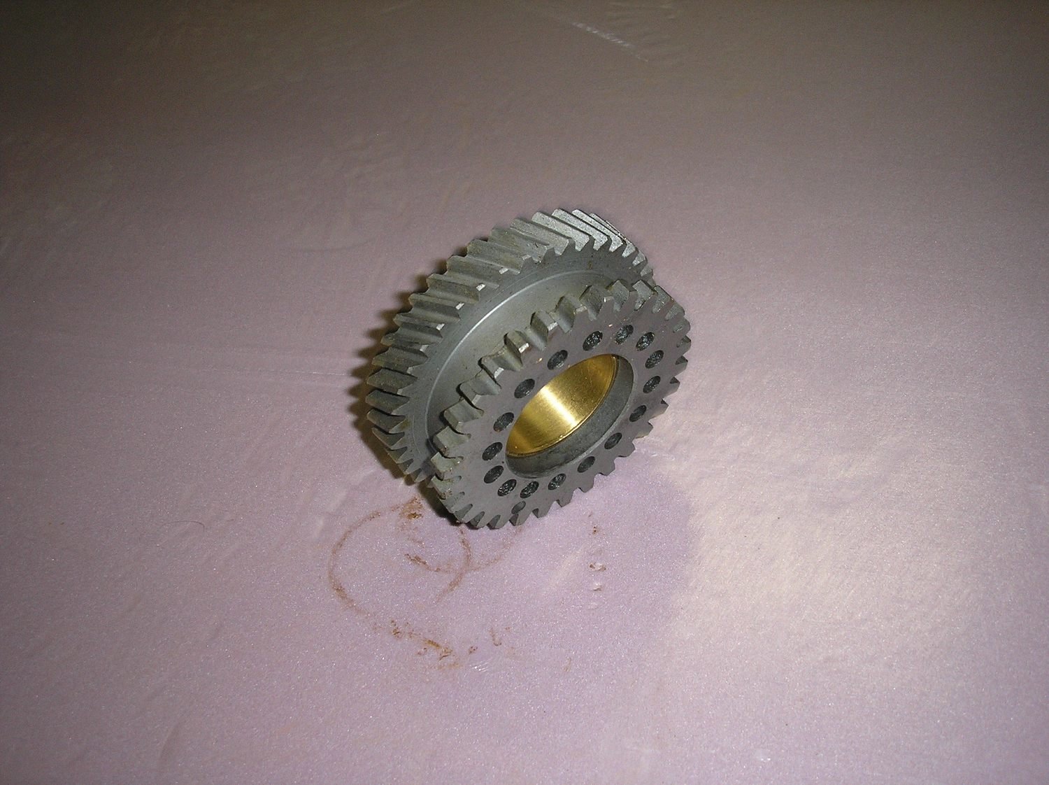 Timing gear wheel with bushing