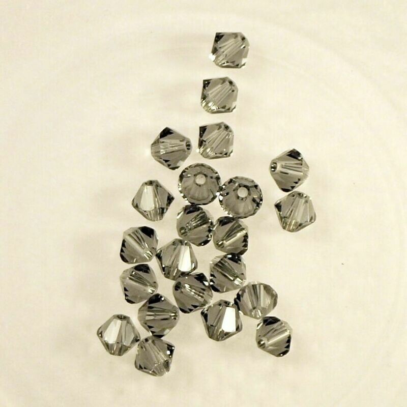 50 perles  toupies en cristal de Swarovski  5328 Black Diamond 4 mm
