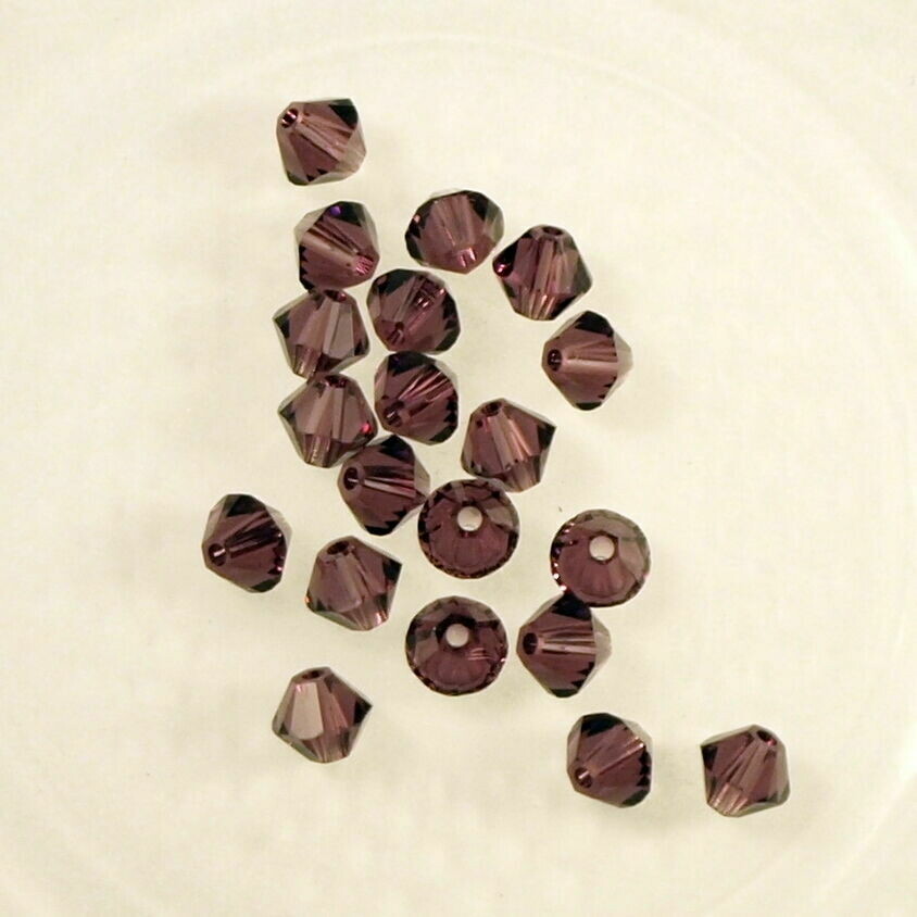50 perles  toupies en cristal de Swarovski  5328 Amethyst 4 mm