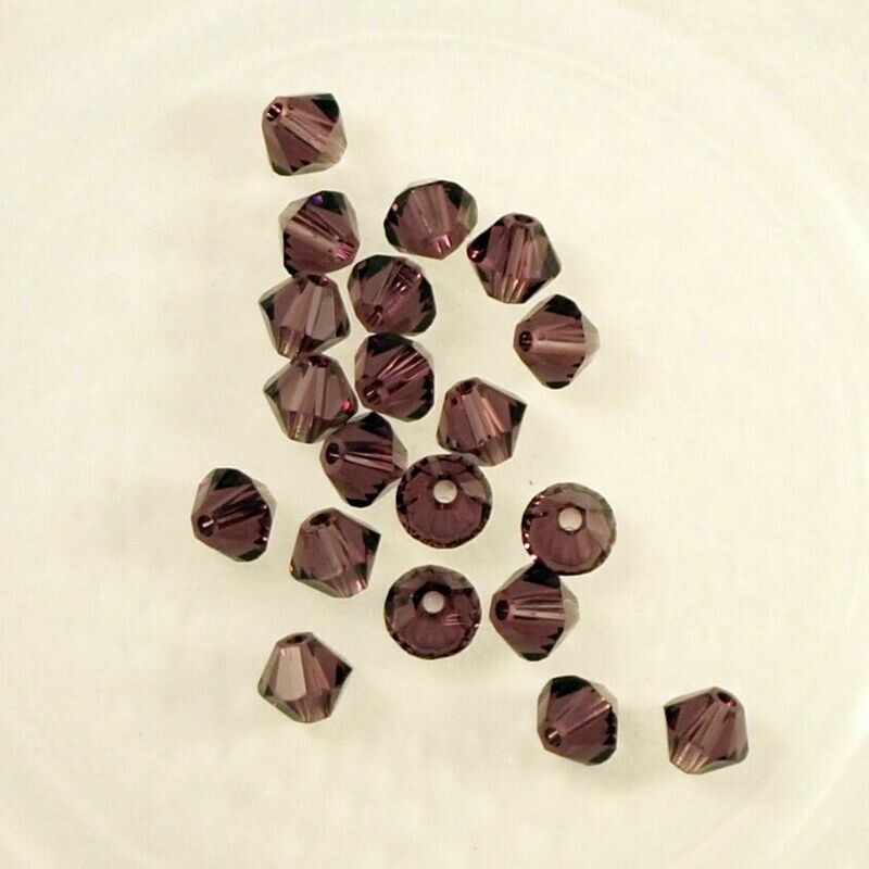 50 perles  toupies en cristal de Swarovski  5328 Amethyst 4 mm