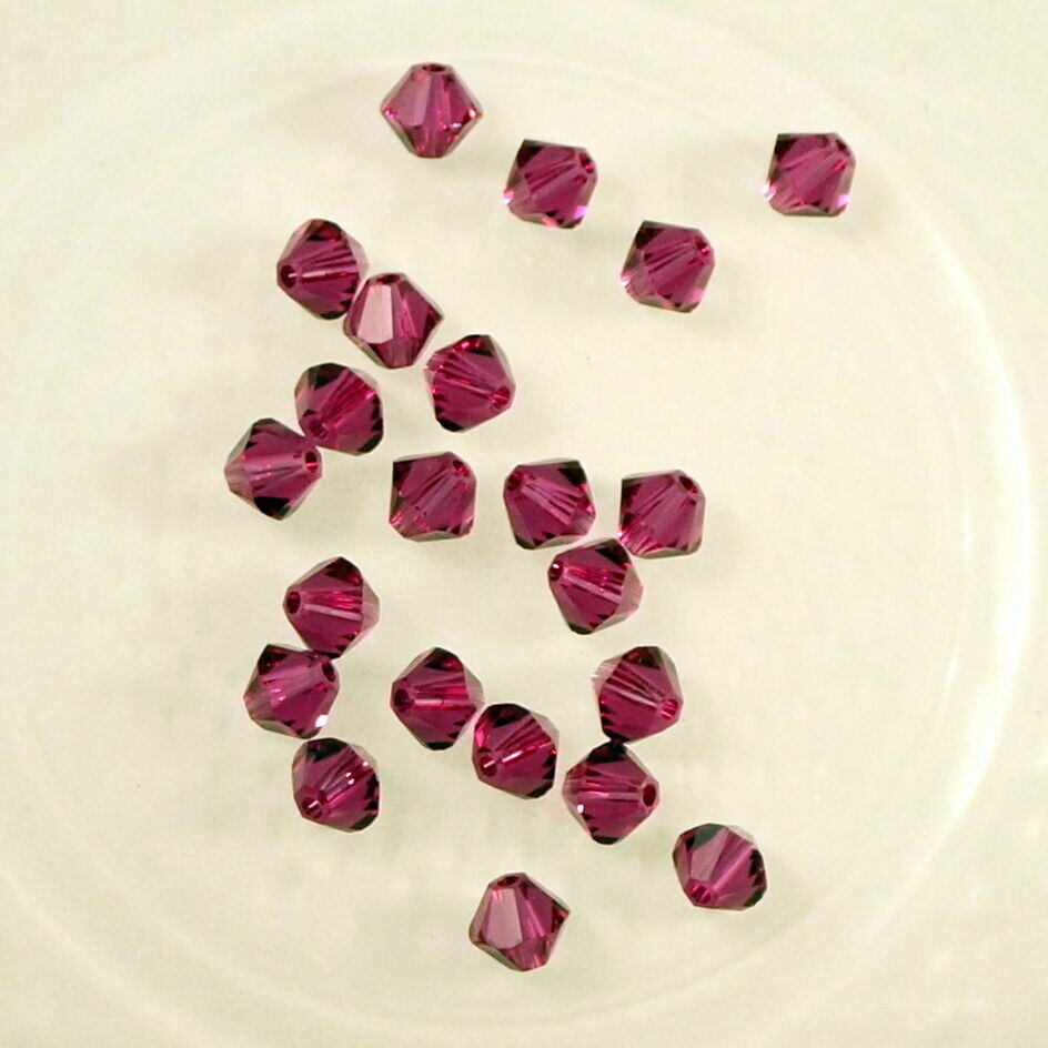50 perles  toupies en cristal de Swarovski  5328 Fuchsia 4 mm
