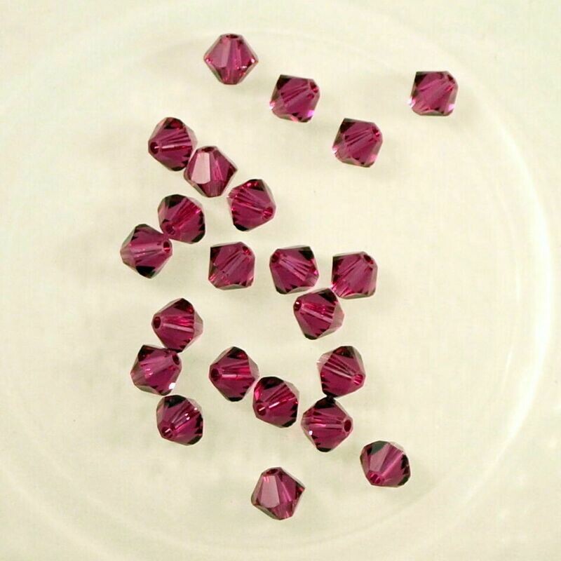 50 perles  toupies en cristal de Swarovski  5328 Fuchsia 4 mm