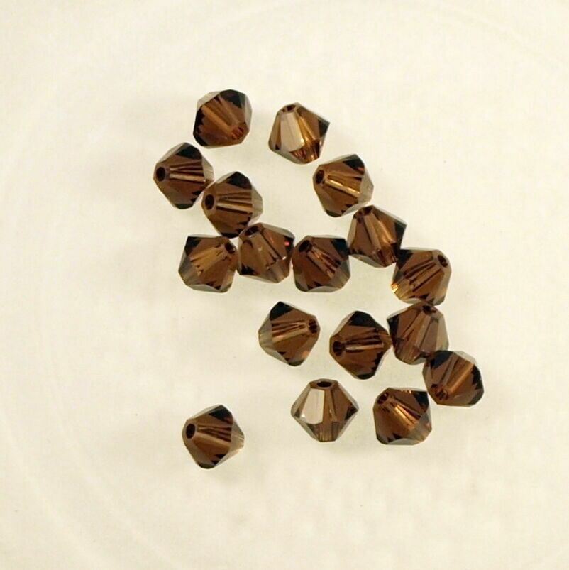 50 perles  toupies en cristal de Swarovski  5328 Smoked topaze 4 mm