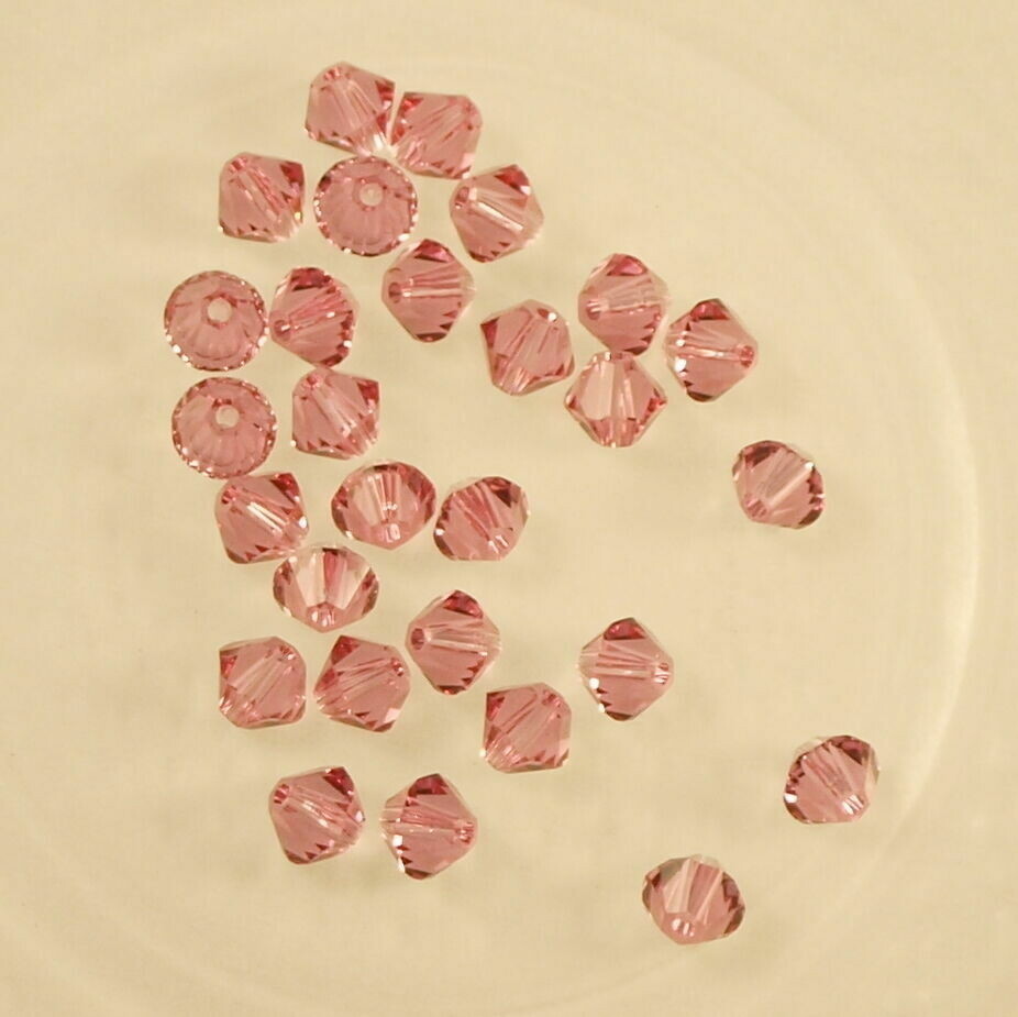 50 perles  toupies en cristal de Swarovski  5328 Rose 4mm