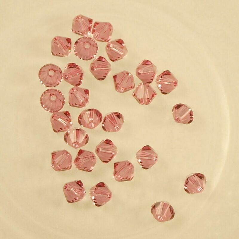 50 perles  toupies en cristal de Swarovski  5328 Rose 4mm