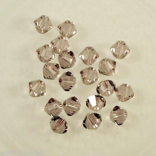 50 perles  toupies en cristal de Swarovski  5328 Light Amethyst 4 mm