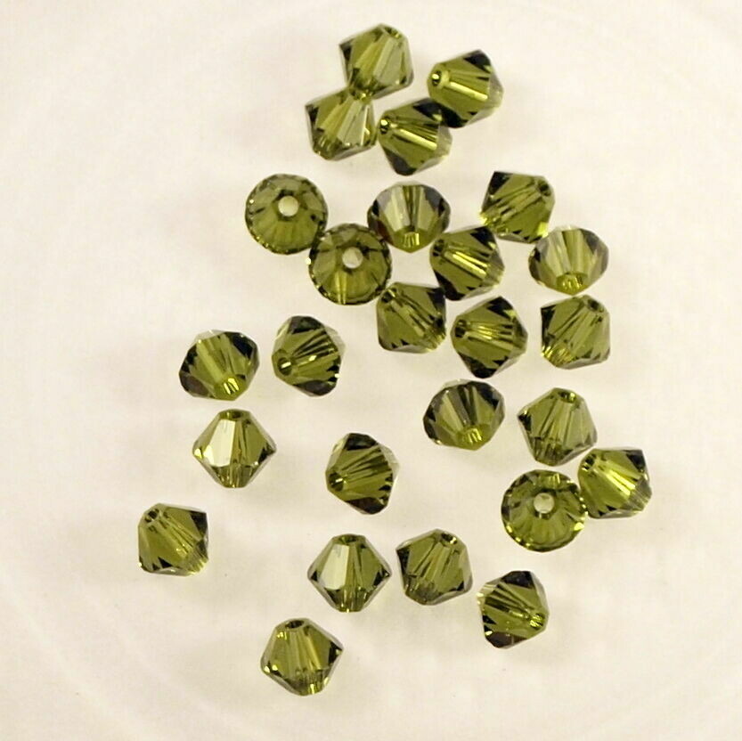 50 perles  toupies en cristal de Swarovski  5328 Olivine 4 mm