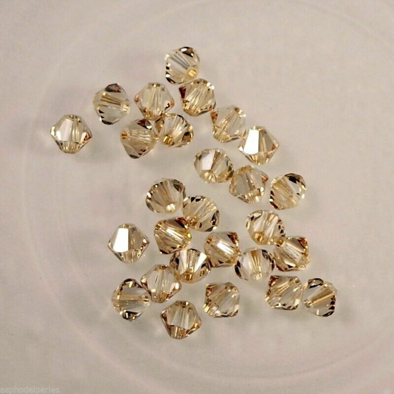 50 perles  toupies en cristal de Swarovski  5328 Crystal Golden Shadow 4 mm