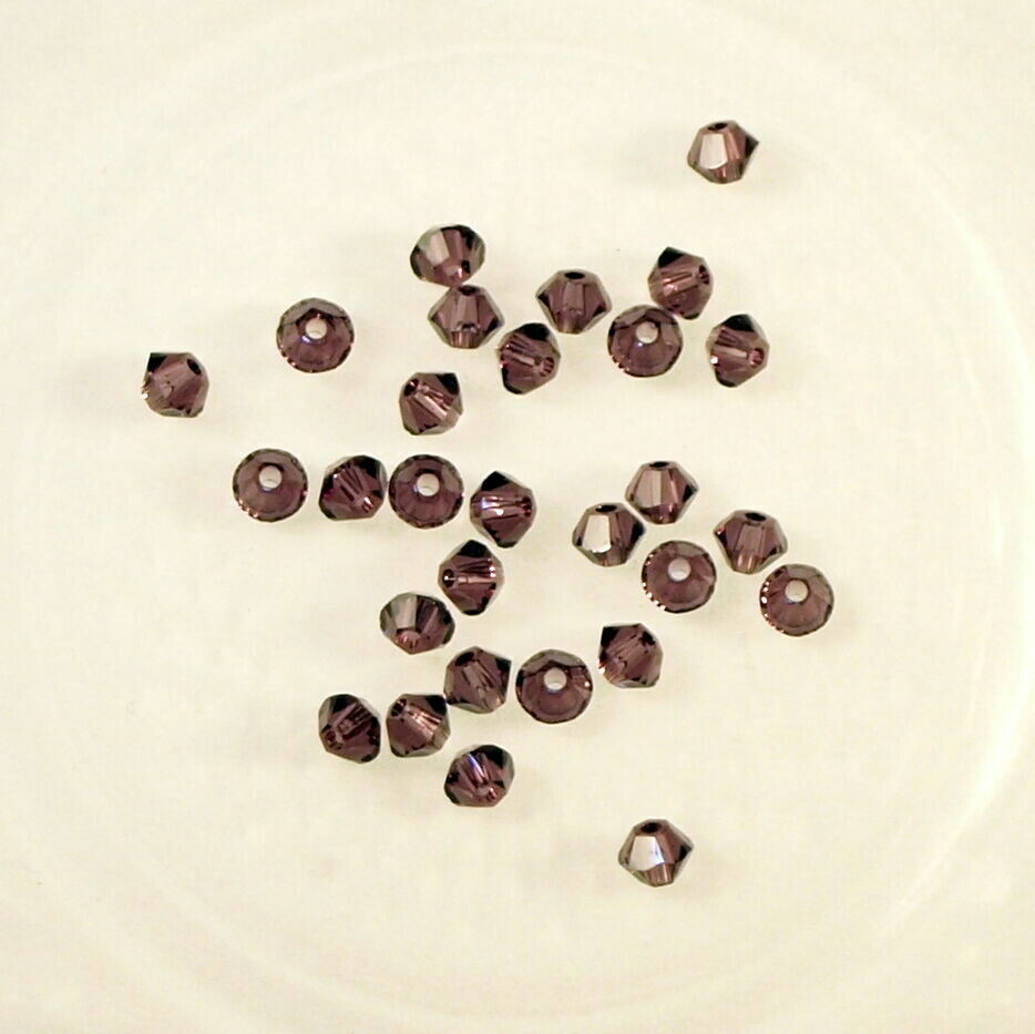 50 perles  toupies en cristal de Swarovski  5328 Amethyst 3 mm