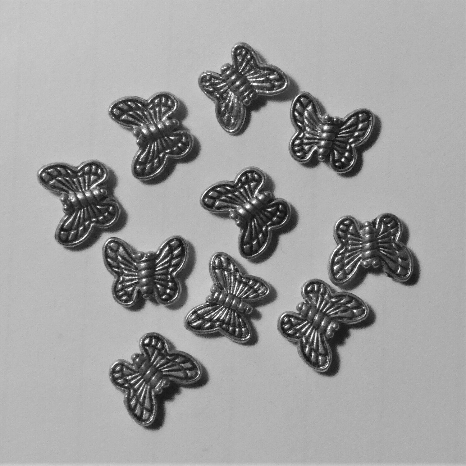 20 perles intercalaires papillon argenté 1 cm