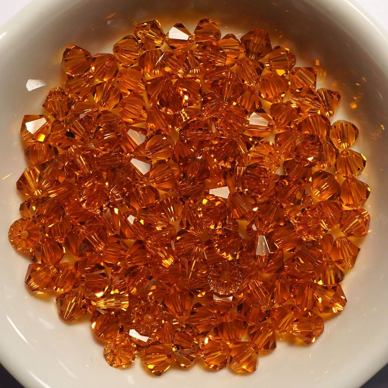 20 perles  toupies en cristal de Swarovski  5301 topaze 5 mm