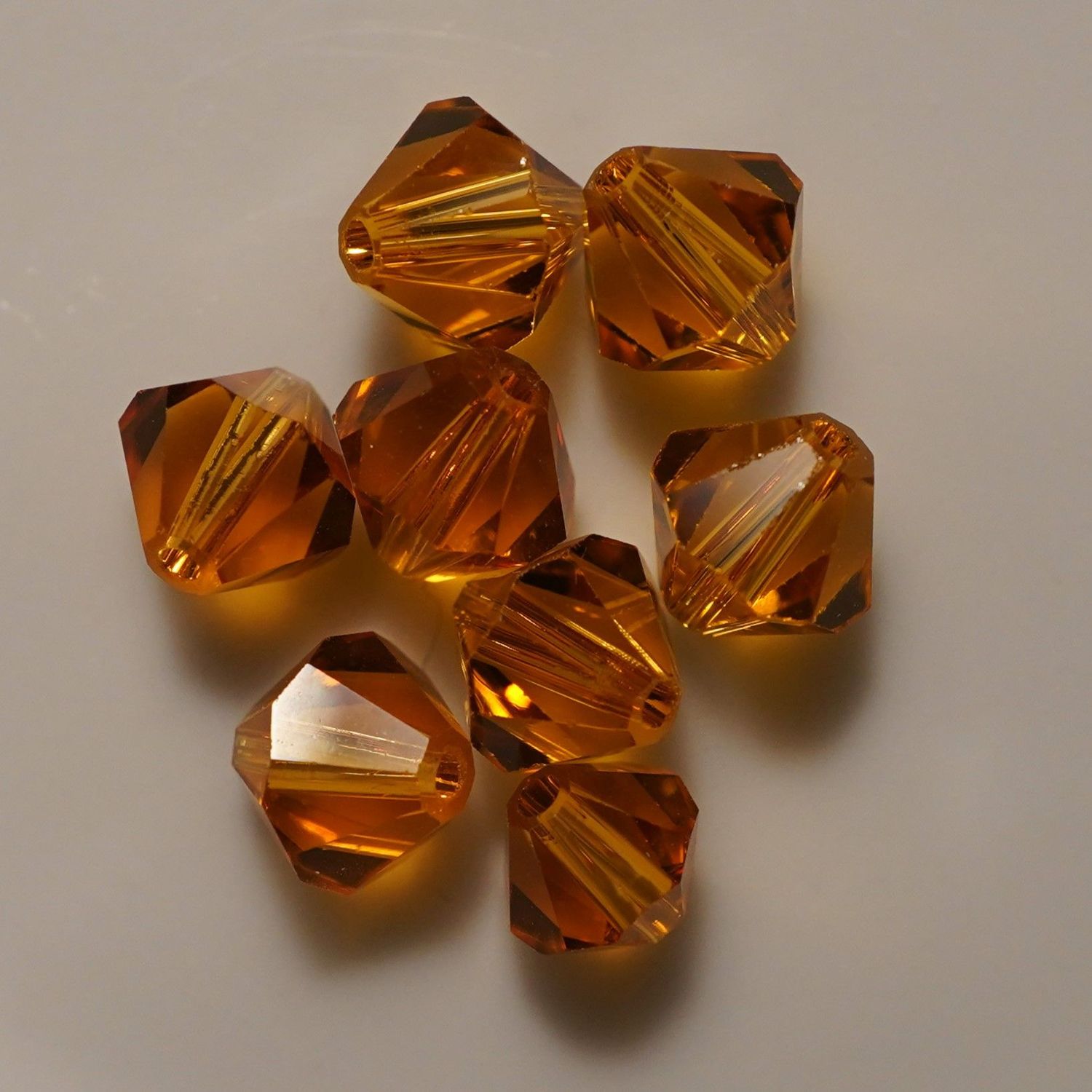 20 perles  toupies en cristal de Swarovski  5301 Topaze 6 mm