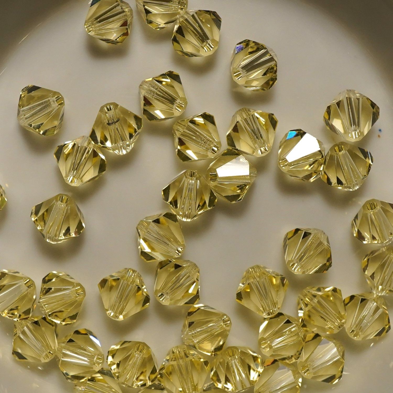 20 perles  toupies en cristal de Swarovski  5301 Jonquil 6 mm