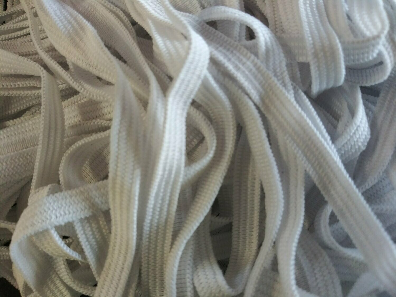 1/4" White Elastic, .29 Cents Per Yard, Available in 25, 50, or 100 Yard Increments