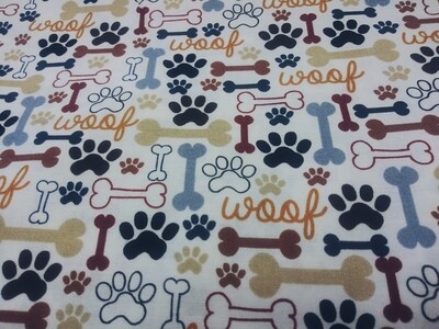 A Dog's Life-Dog Bones and Paw Prints on Cream Fabric