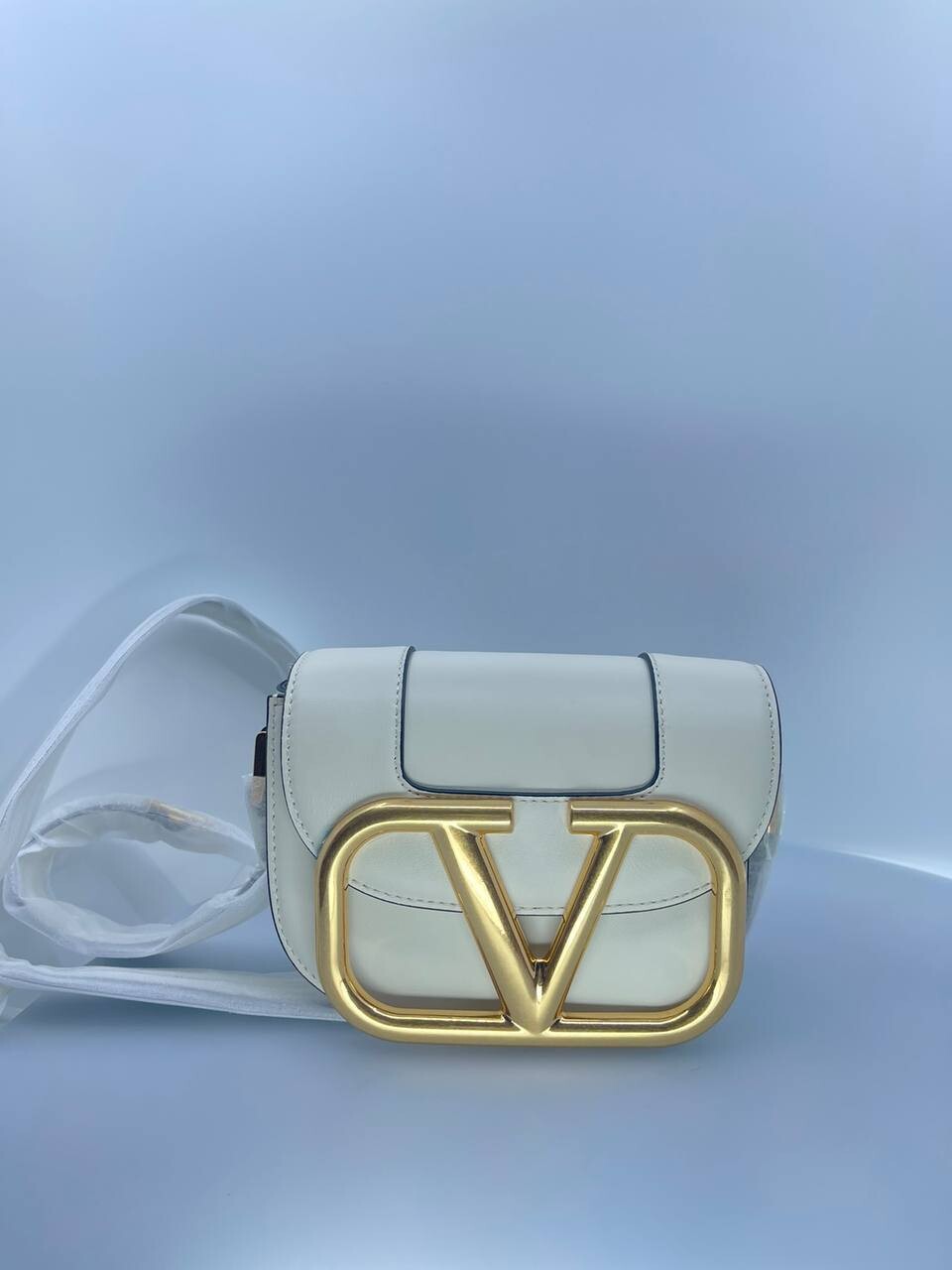 V logo white bag