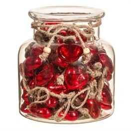 Mini red glass heart decorations in glass jar
