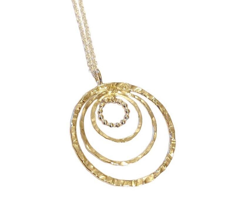 4 static circle pendant by Diana King