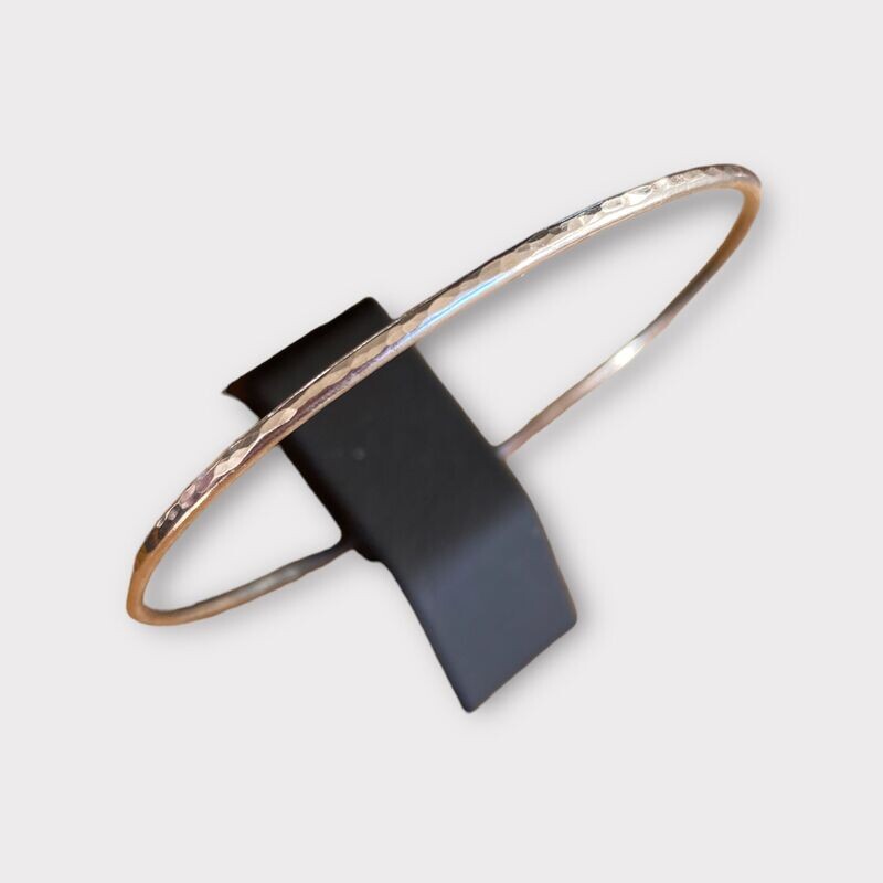 Silver stcking bangle textured by Margaret Rae