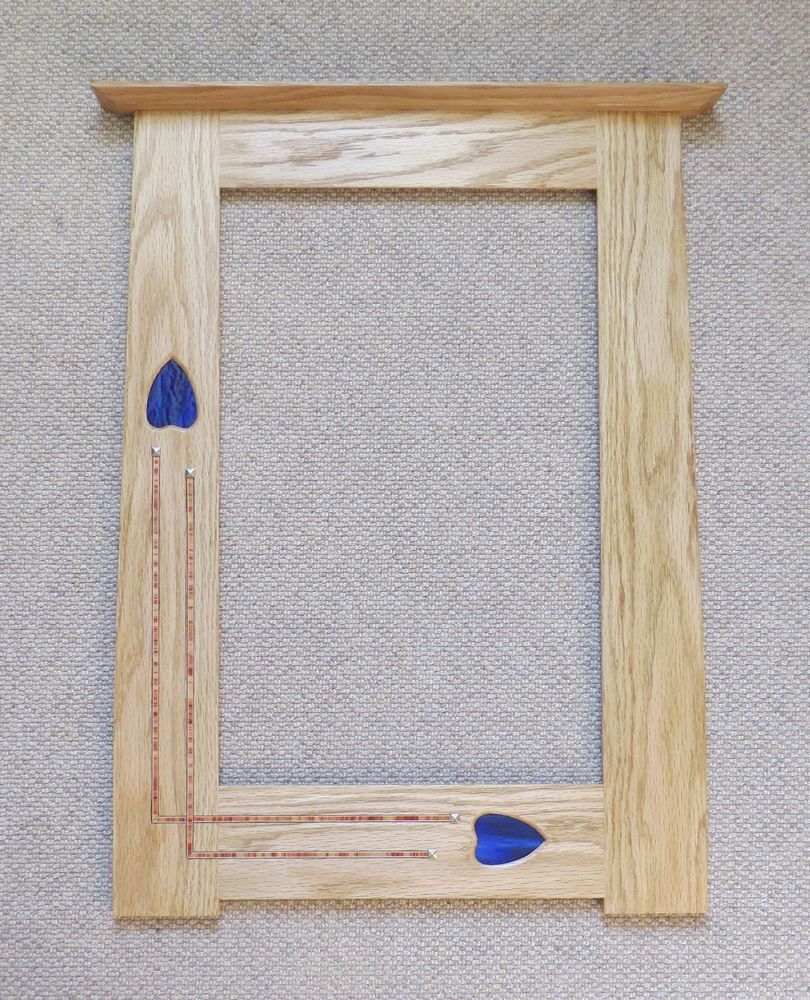 Portrait mirror with blue fused glass, inlay & copper studs by Archie McDonald