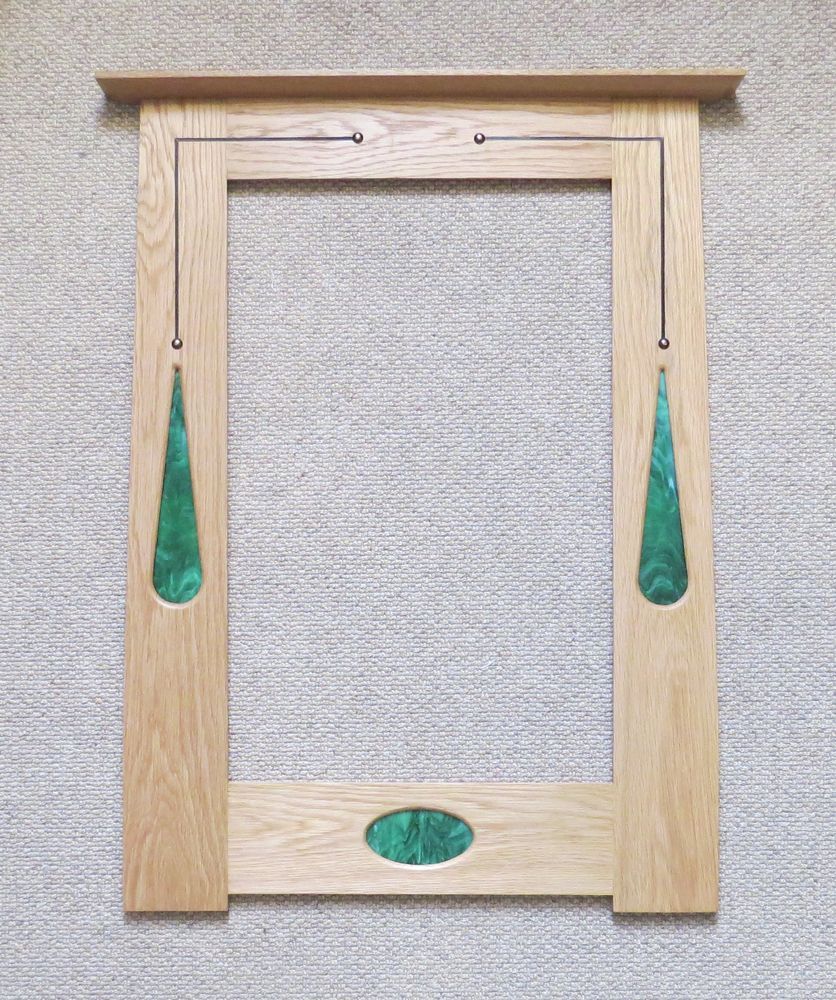 Portrait mirror with green fused glass, inlay & copper studs by Archie McDonald