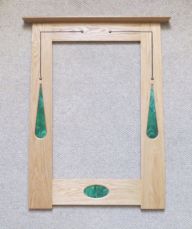 Portrait mirror with green fused glass, inlay & copper studs by Archie McDonald