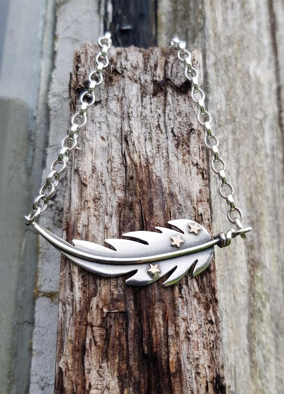 Feather necklace by Silverpickle