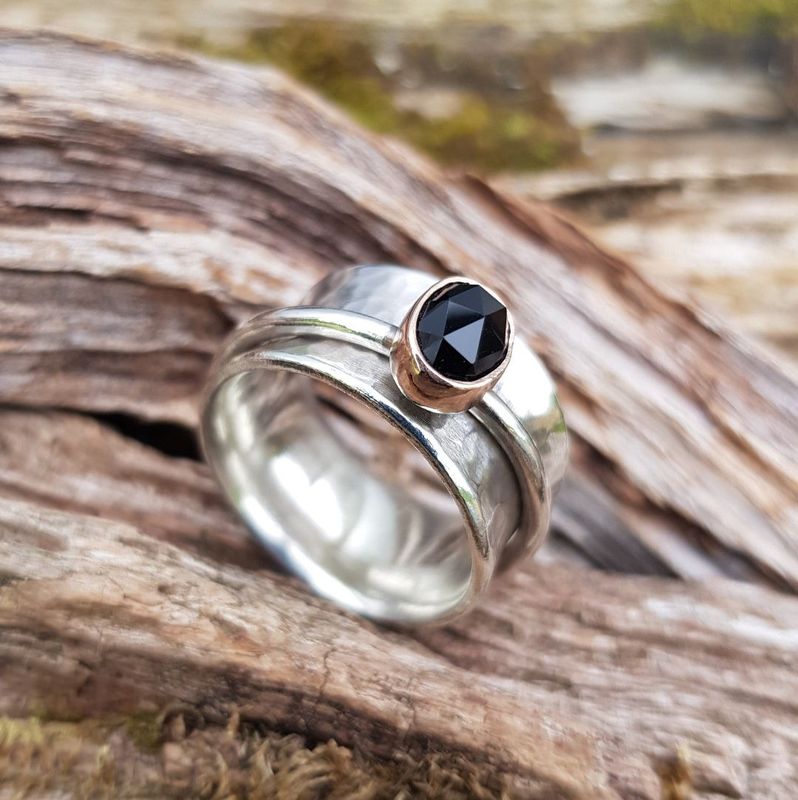 Black spinel spinner ring by Silverpickle