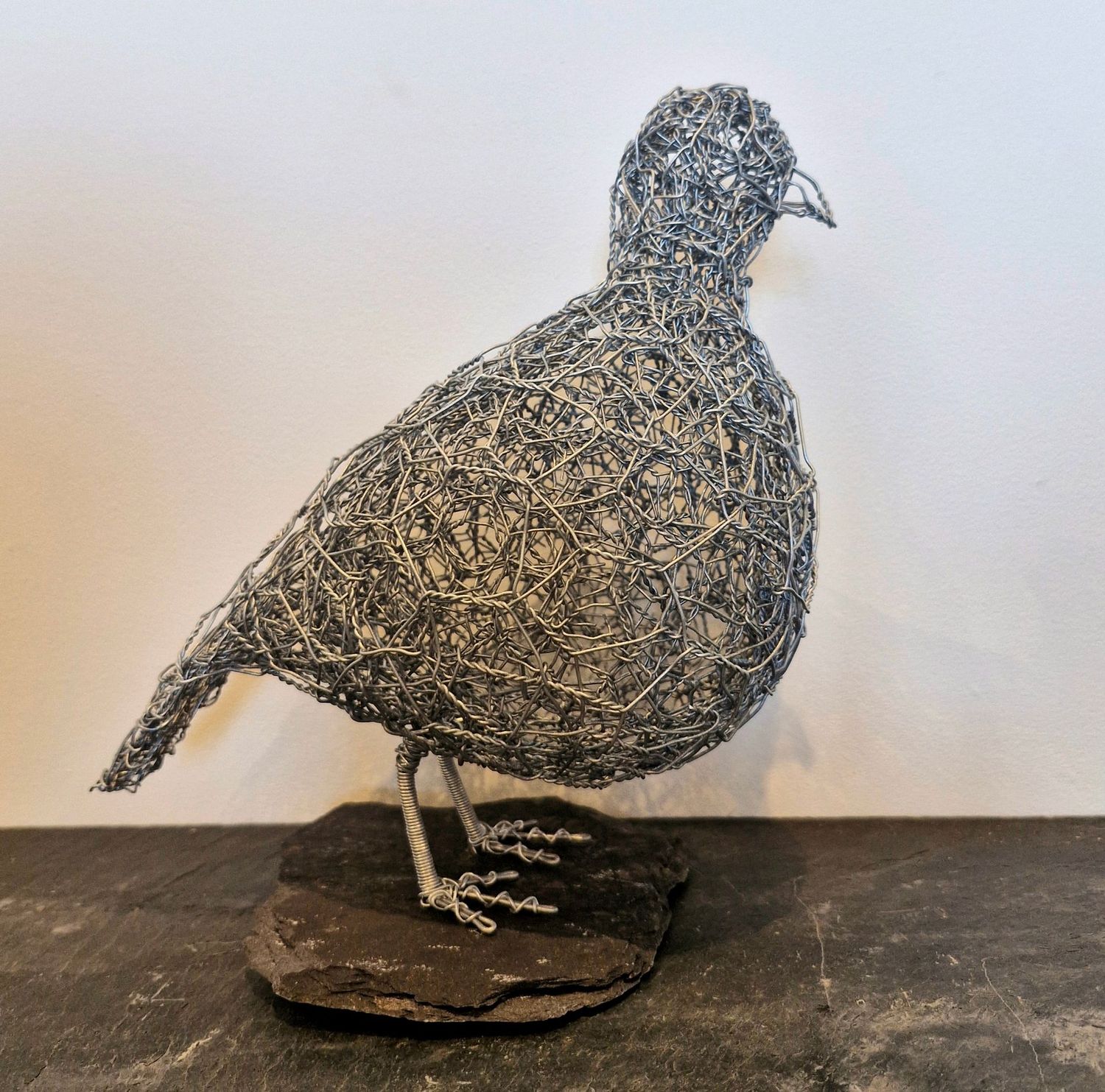 Partridge on slate by Laura Woods
