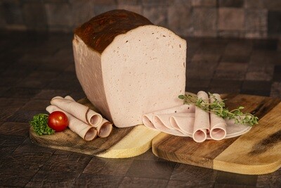 Fleischkäse geschnitten in Schale
