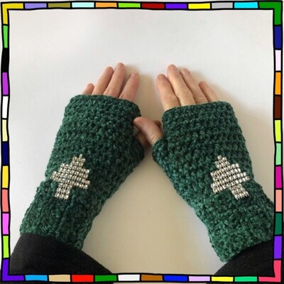 "Women's dark green chenille hand crocheted fingerless gloves which are decorated with sparkling silver cut out tree motifs"
