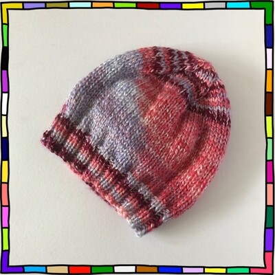 "Kids plumb, pink, lilac and white colour hand knit beanie hat"