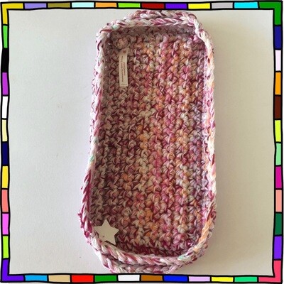 "rectangular handmade purple, pink and lilac crocheted basket with handles"