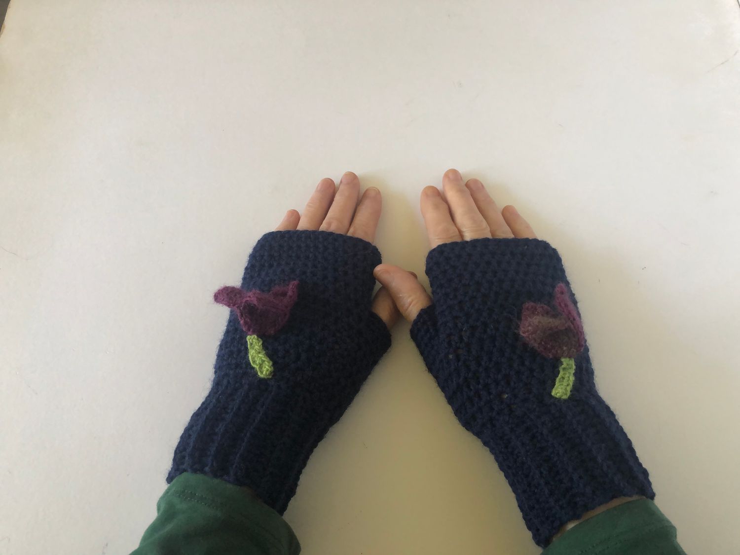 &quot;women&#39;s lightweight navy blue wool mix handmade crochet fingerless gloves, adorned with plum to purple colour crocus flower motifs&quot;