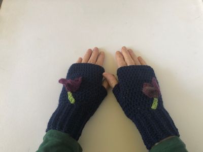 &quot;women&#39;s lightweight navy blue wool mix handmade crochet fingerless gloves, adorned with plum to purple colour crocus flower motifs&quot;