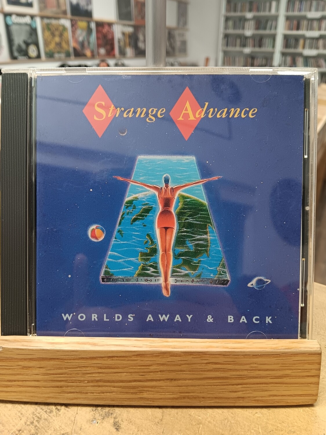 STRANGE ADVANCE - Worlds away & back (CD)