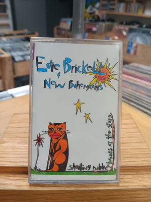 EDIE BRICKELL &amp; NEW BOHEMIANS - SHOOTING RUBBERBANDS AT THE STARS (CASSETTE)