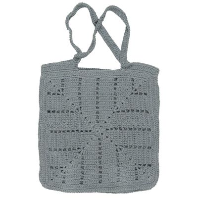 An elegant crochet bag, skillfully handcrafted in dusty blue color, displaying exquisite craftsmanship.