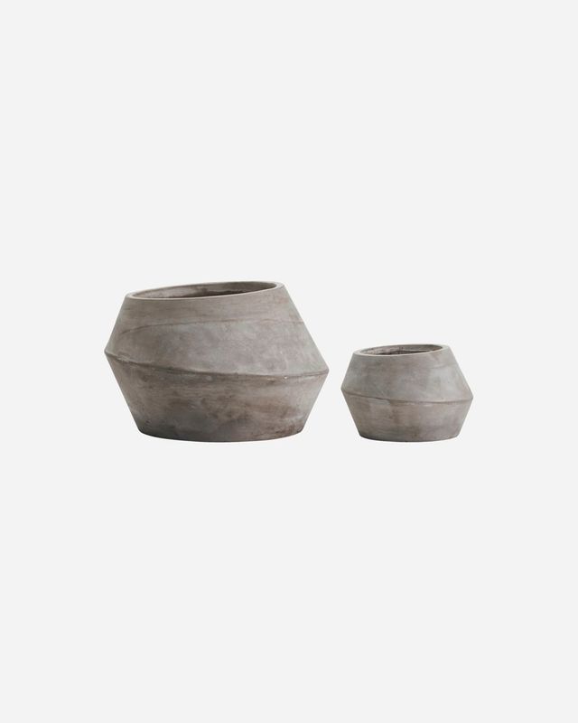 Set of two grey colored planters made in fiber cement.