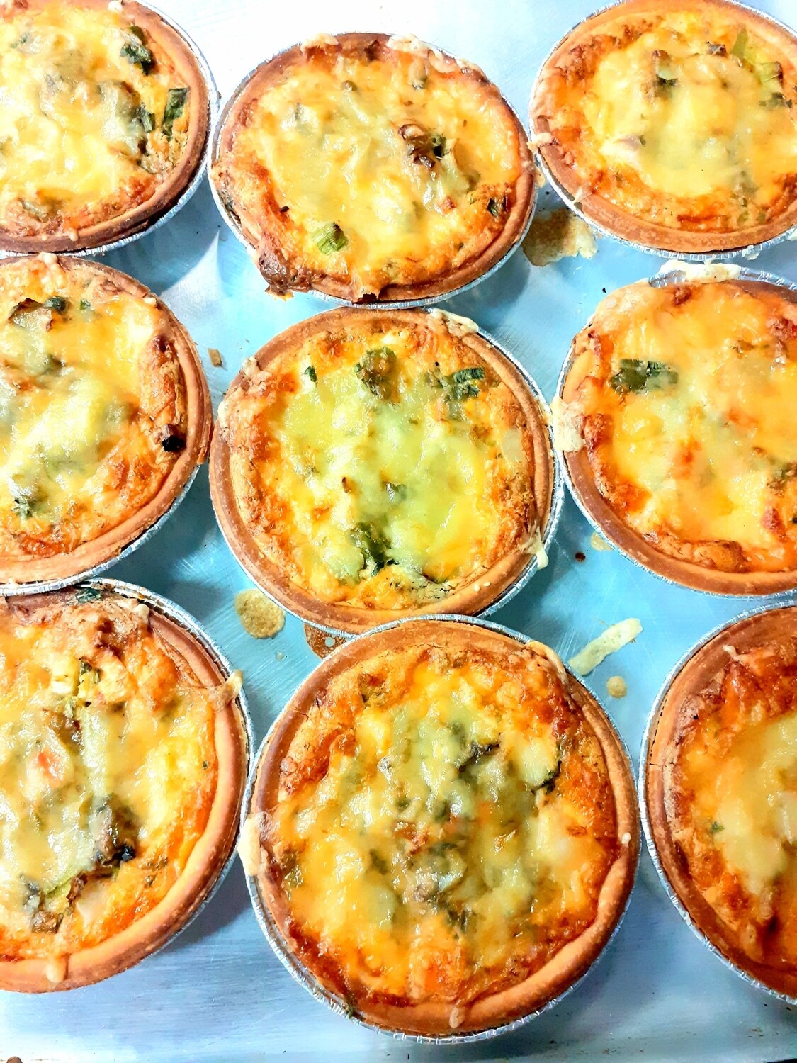 Homemade smoked haddock, spring onion, spinach and Gruyère cheese tart