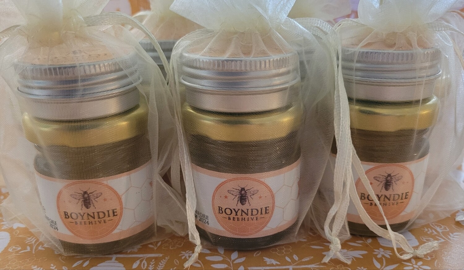 Mini honey jar and lip balm in organza gift bag