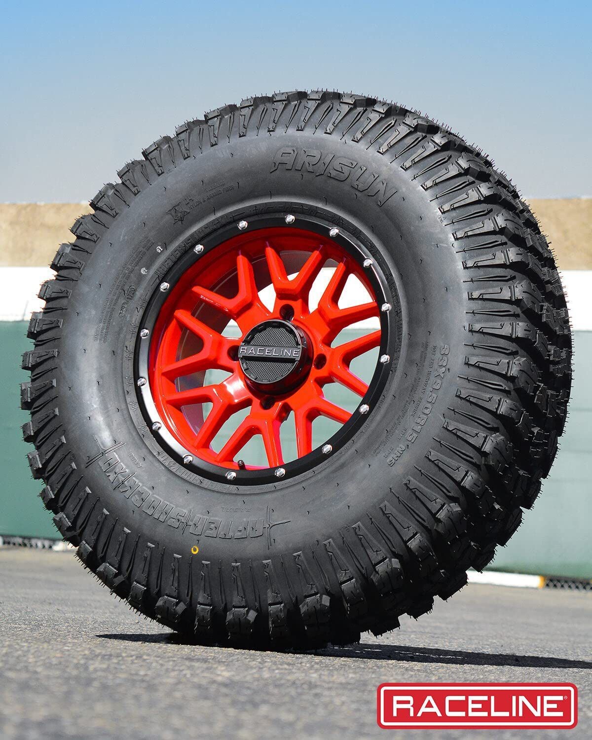 Raceline 15X7 4x137 red Wheels & 32x10-15 arisun aftershock XD Tires  (FREE Mounted)