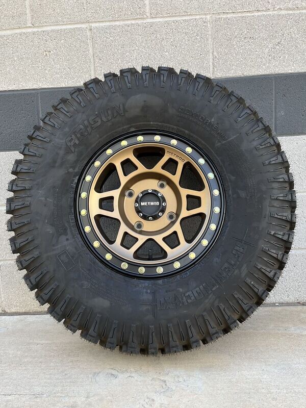 Method 15X7 4x137 4+3 beadlock bronze  Wheels & 30x10-15 Arisun After Shock XD Tires  (FREE Mounted